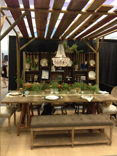 Archive Rentals showed off new pieces including the 'Sofia' chairs pictures at the head of the table. The crate wall and pergola are custom-commissioned pieces, newly available in rental inventory.