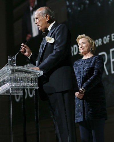 A new Swarovski crystal lectern, composed of about 300 clear crystals (a mixture of rectangular and square) and created specially for the awards, served as a centerpiece onstage. The crystals were attached to acrylic panels to create a light and airy look, which allowed attention to be focused on award recipients like Oscar de la Renta, who accepted his Founder's Award from Hillary Rodham Clinton.
