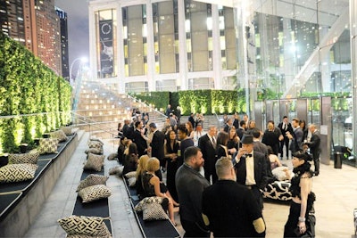 Matching the tone of the C.F.D.A. Awards journal photographer Peter Lindbergh, recognized for his black-and-white photography and elegant period setting of the award ceremony design, the cocktail hour in the atrium featured a unifying white decor peppered with black-and-white graphics. The pattern appeared on the pillows, conversation tables, and even the bars, which were marked with all-black molding inspired by the award set.