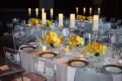 The dining room was lavishly embellished with fine crystal and silver linens from Be Our Guest. Winston Flowers provided yellow roses and irises.