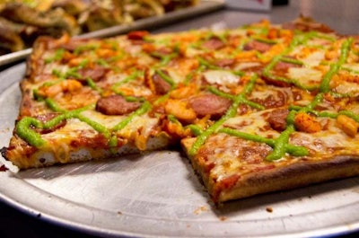 2 Boots Pizza created the 'All-Star Slice' topped with andouille sausage, crawfish, shrimp, and jalapeno pesto.