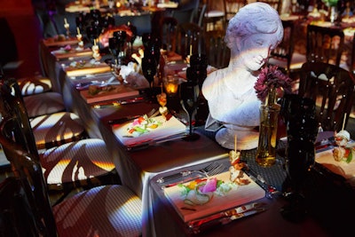 Tables were decorated with brocade linens, busts, and candelabras.