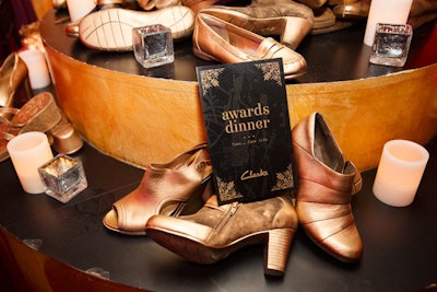 Golden shoes decorated the space and matched the evening's black-and-gold collateral.