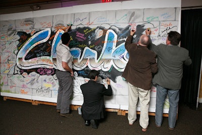 As guests entered, they tagged a graffiti wall created by Artists for Humanity. The banner now hangs in Clarks's customer service department.