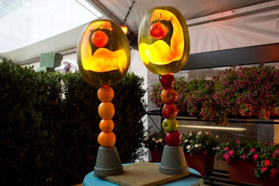 Fruit artist Hugh McMahon crafted two working lamps using watermelons, oranges, and apples.