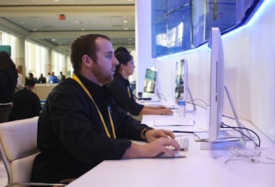 Behind the hub’s front desk, event staffers monitor and respond to comments and questions posted to Twitter and Facebook. Because the volume of social activity is so high throughout the event, those assigned to monitor it are each focused on specific content.