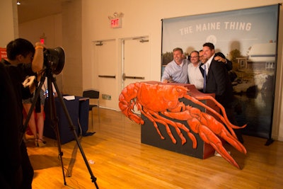 Guests could pose atop a giant wooden lobster at the photo booth station.