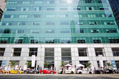 The Greater Miami Convention & Visitors Bureau promoted Miami tourism by offering free taxi rides in luxury cars. The vehicles stationed at the temporary stand on Sixth Avenue included a Bentley, three Lamborghinis, a Rolls-Royce, two Ferraris, an Aston Martin, and a McLaren used for show.