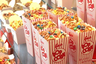 Popcorn Couture Cinema Break, including mixtures such as All American (bow-tie pretzels, peanuts, and M&M’s), Rio Bravo (chipotle chili powder, corn chips, and lime), and Bedtime for Bonzo (banana chips, Nestlé Buncha Crunch, and toasted coconut), by Walt Disney World Swan & Dolphin in Orlando