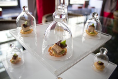 Another one of Callahan's detailed presentations includes pheasant housed under tiny handblown glass domes.