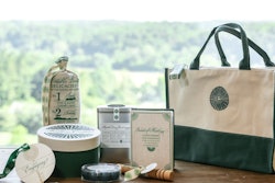 Guests picked up their elaborately packaged welcome totes, designed by Gifts for the Good Life, at the registration area. The branded bags were packed with Southern treats, as well as Prohibition-themed items. A linen bag printed with the words “Portable Pantry” included jars of locally made caramel candies, smoky almonds, and peach-flavored cookies. The calligraphy on the gifts and printed materials was provided by Deborah Nadel Design.