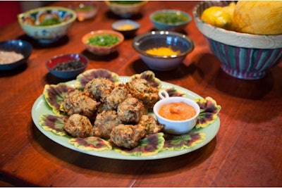 Photo by Rob Penner Summer Squash & Nasturtium Fritters with Romesco