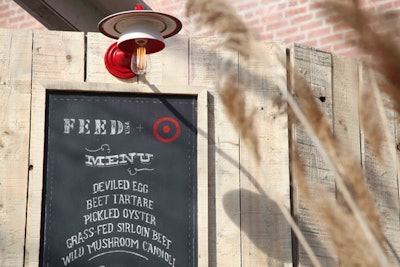 The lighting fixtures above the bar in the dinner tent were crafted from Feed U.S.A. for Target plates and cups.