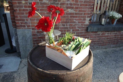 Guests could also help themselves to boxes filled with crudités and jars of ranch dressing, which were placed atop wooden barrels.