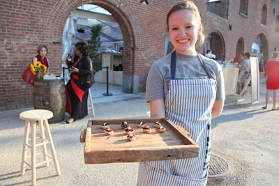 Waitstaff dressed in Feed-branded aprons and T-shirts served hors d'oeuvres like beet tartare (pictured), deviled eggs topped with bacon, pickled oysters, and tiny cannolis stuffed with wild mushroom puree.