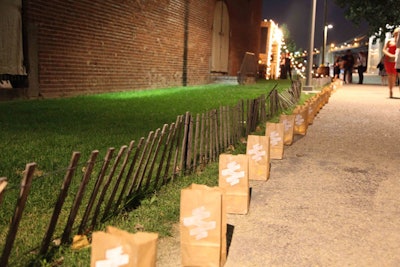 Paper bag luminarias—stamped with the event's hashtag—lined the pathways as guests exited the event at the end of the night.