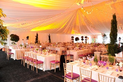 The lighting in the Conservatory tent was reminiscent of a sunset in Italy. Over the course of the evening, the lighting subtly changed from amber hues to a midnight blue, inviting guests to dance to the sounds of the Kevin Osbourne Band under what looked like a night sky. To make one last impression on guests, Steven Starr Events sent attendees home with madeleine cookies.