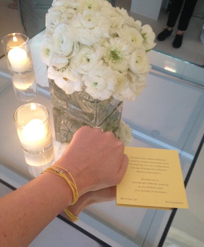 Before entering the elevators that led to the rooftop, guests were given chic yellow bracelets with magnetic closures and informational cards detailing Clinique's Twitter handle and the event's hashtag.