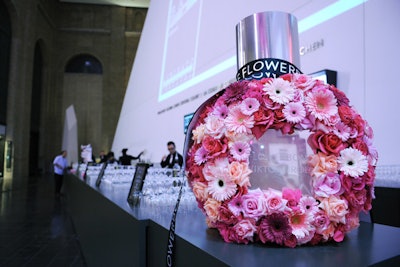 A giant, floral replica of a Flowerbomb bottle decked the bar.