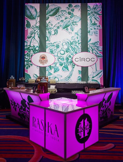 All of the bars, each sponsored by a different liquor brand, glowed in pink with a green tropical-print backdrop.