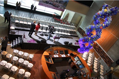 Staging with tiered seating and press risers at a research center.
