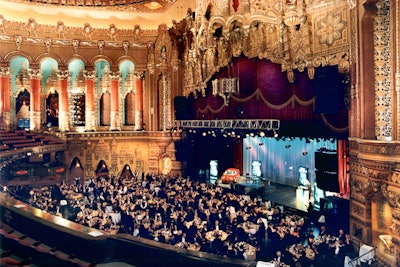 Our staging seamlessly transforms an auditorium into a magical party venue.