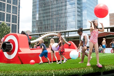 Kids enjoy a giant sprinkler at Target’s Make Summer Funner event