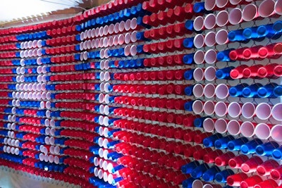 On the rear wall, hundreds of red and blue Solo cups were arranged to spell out 'Congrats.'
