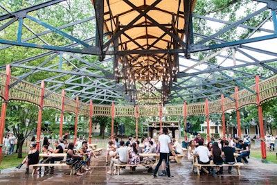 A vintage bumper car pavilion from 1900 has been turned into a 40- by 100-foot dining area and party space. Housed in the center of the carnival, it's a space where festivalgoers can relax and enjoy live band performances or grab a bite courtesy of Le Gamin Café and French-born chef Christophe Breat, who serves classic French carnival fare like croque-monsieurs, crêpes, frites, and burgers.