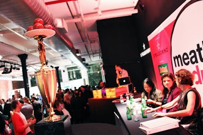 As part of the 2011 New York City Wine & Food Festival, professional chefs competed to make the tastiest meatball at the San Pellegrino Meatball Madness event. The toque with the highest score from the judges received a trophy topped with a plate of meatballs.