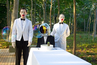 In 'My Favorite Food,' artist Yao Zhang served a continuous course of bubbles emanating from a headless human form presided over by two performers dressed as white-jacketed waiters with giant red lips.