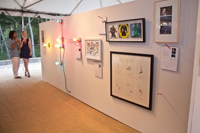 Throughout the night, guests were able to bid on items listed in the silent auction, including G.T. Pellizzi's 'Conduits in Red Yellow and Blue (Figure 26),' which combined lightbulbs, porcelain lamp holders, galvanized steel, and wire.