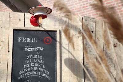 In June, Target celebrated the launch of its fashion and home accessories collection with charity organization Feed by hosting a rustic-Americana-themed dinner party in Brooklyn. The lighting fixtures above the bar in the dinner tent were crafted from Feed U.S.A. for Target plates and cups.