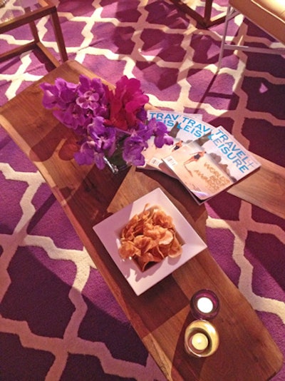 Organic-looking walnut coffee tables displayed copies of Travel & Leisure's World's Best issue as well as bowls of homemade potato chips.