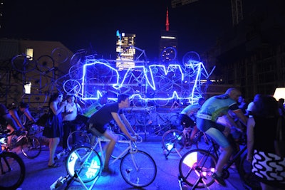 Teams of triathletes pedaled bike generators provided by Arizona-based ASE Power. The athletes' motion discharged electricity into the event's power grid.