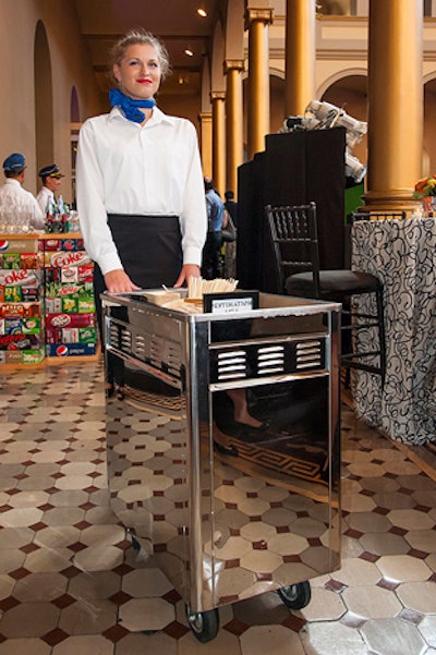 Occasions Caterers created multiple destination-themed food stations on the second floor. A server dressed as a retro airline stewardess pushed a catering cart throughout the reception with bites from Asia.