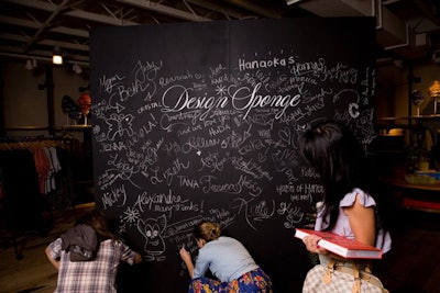 To promote its first book, blog Design Sponge toured the West Coast in 2011. At a book signing in Los Angeles, guests could pose in front of—and draw on—a chalkboard backdrop created by event and styling production company Bash Please.