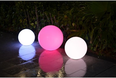 LED balls at various sizes and colors placed outdoors as accents.