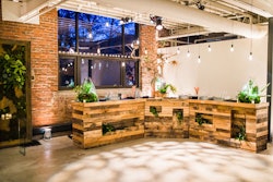 A rustic, three-piece pallet bar is one of the new rentals available for fall 2013 from Amaryllis. The overall footprint of the U-shaped bar is about 15 feet long and 6 feet deep, and open crevices on the façade can hold floral arrangements.