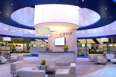 Charles Schwab interior design featuring extra-long white curtains at the annual convention