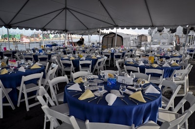 A dinner event under tenting with the guns in the background. Photo: Derek Cross