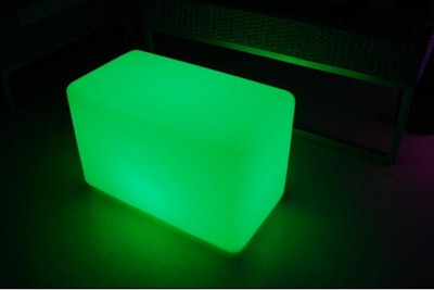 Green LED table emitting radiant glow.