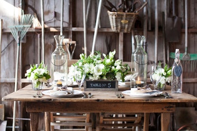 Pressed Cotton sells gray-washed wooden chalkboard boxes, from $19 each, that can be filled with plants or flowers and used as centerpieces. Have the boxes do double duty by using chalk to write table numbers on the side.