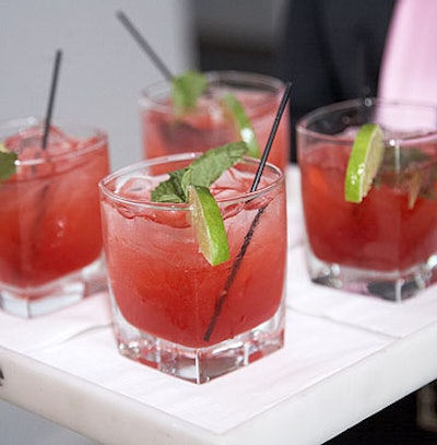 Raspberry mojito garnished with fresh lime and mint