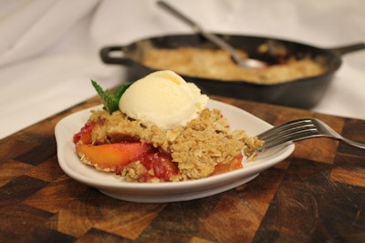 Peach and berry crisp with homemade vanilla ice cream