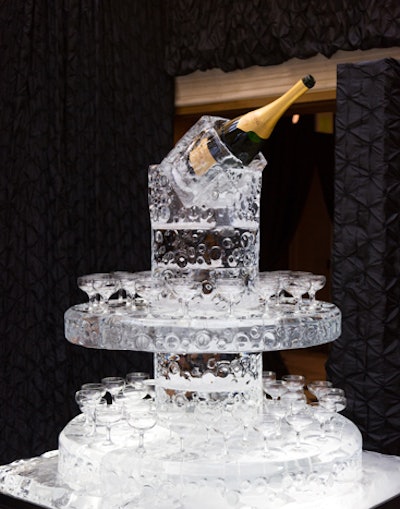 A custom-designed ice sculpture positioned in the center of the entrance held champagne glasses in the round with a Krug jeroboam centered and elevated for all to see.