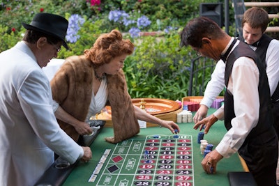 Guests gambled at a roulette table and noshed on tray-passed Moroccan-influenced hors d’oeuvres such as mini crab cakes with harissa remoulade, smoked salmon on potato pancakes with cardamom crème fraiche, lamb meatballs with tomato and minted yogurt dipping sauce, and spanakopita. A quartet played vintage ‘40s tunes.