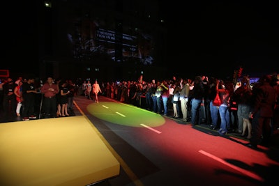Inside a parking garage, a stylized roadway served as a runway at a fashion show as part of the Mini Countryman launch in New Delhi.