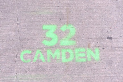 At key intersections near the building, spray-painted footsteps and 32 Camden logos advertised the event.