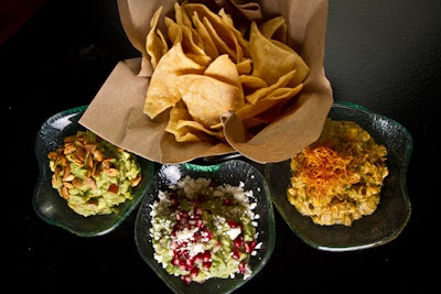 The Mercadito Group, which owns local restaurants Mercadito, Tavernita, and Little Market Brasserie, has launched its new MH Catering division, delivering fare from all three restaurants to off-site meetings and events. Menu items include a guacamole trio (pictured) and oysters, and bar options include margaritas, kegged cocktails, and house-made sodas.